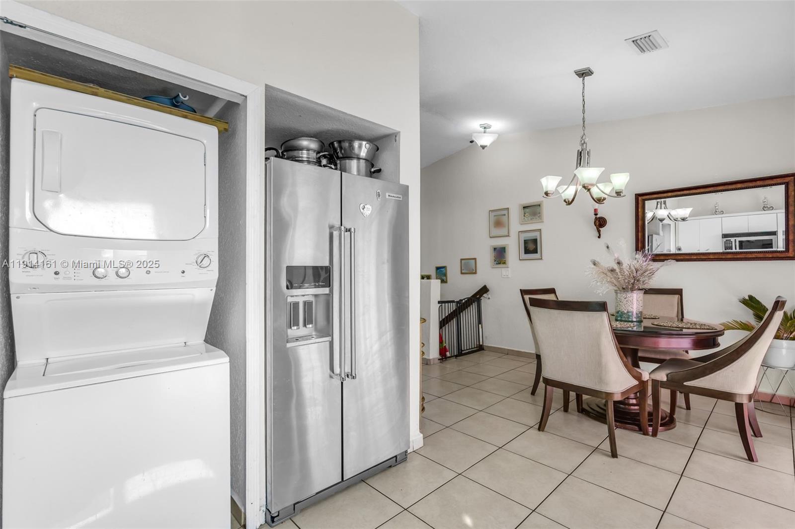 7271 Northwest 174th Terrace, Unit 202 Hialeah, FL 33015 - Photo 10 of 22 a view of kitchen and dining area with furniture