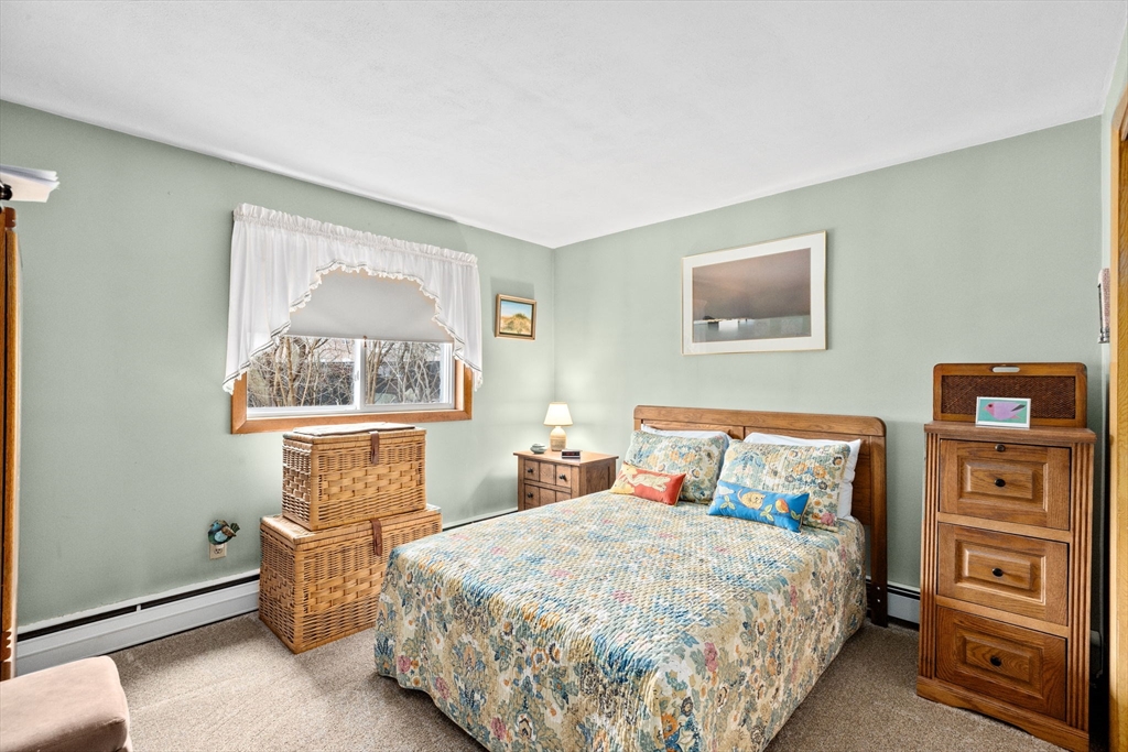 38 Jacqueline Road, Unit B Waltham, MA 02452 - Photo 11 of 21 a bedroom with a bed and a window