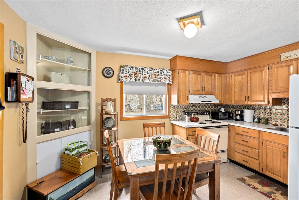 38 Jacqueline Road, Unit B Waltham, MA 02452 - Photo 7 of 21 a kitchen with stainless steel appliances granite countertop a stove and a refrigerator