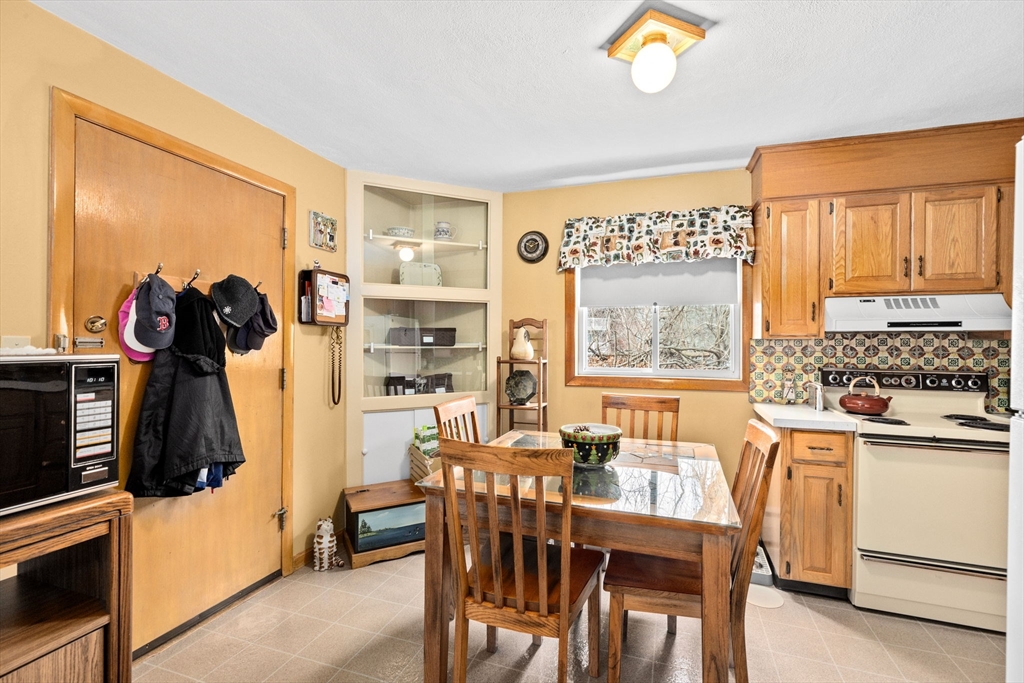 38 Jacqueline Road, Unit B Waltham, MA 02452 - Photo 8 of 21 a view of a a dining room with furniture window and outside view