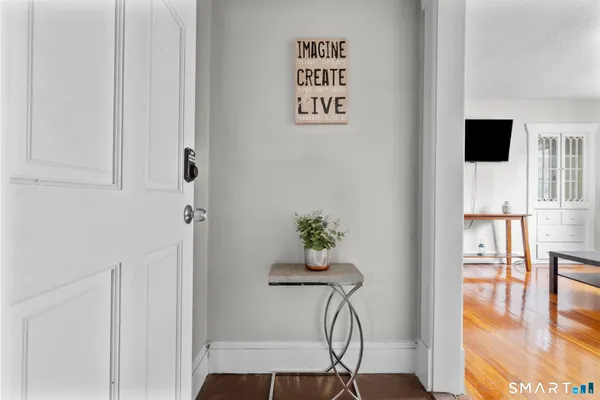 a view of entryway with wooden floor