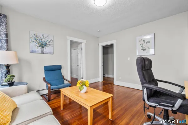 a living room with furniture and a window