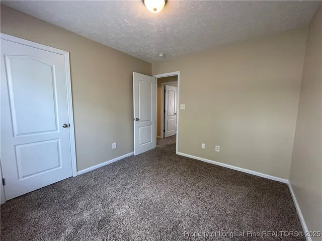 an empty room with windows and view of windows