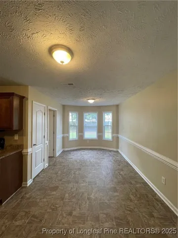 wooden floor in an empty room and a window