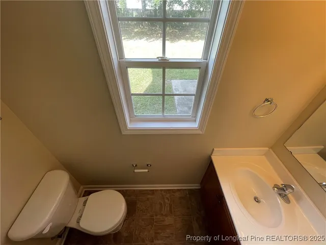 a bathroom with a sink a toilet and a tub