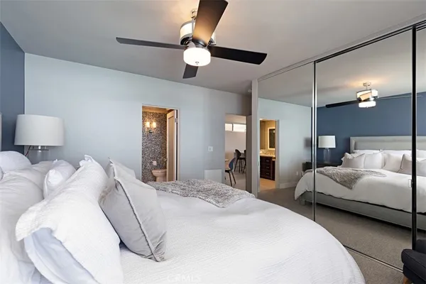 a bedroom with bed and window