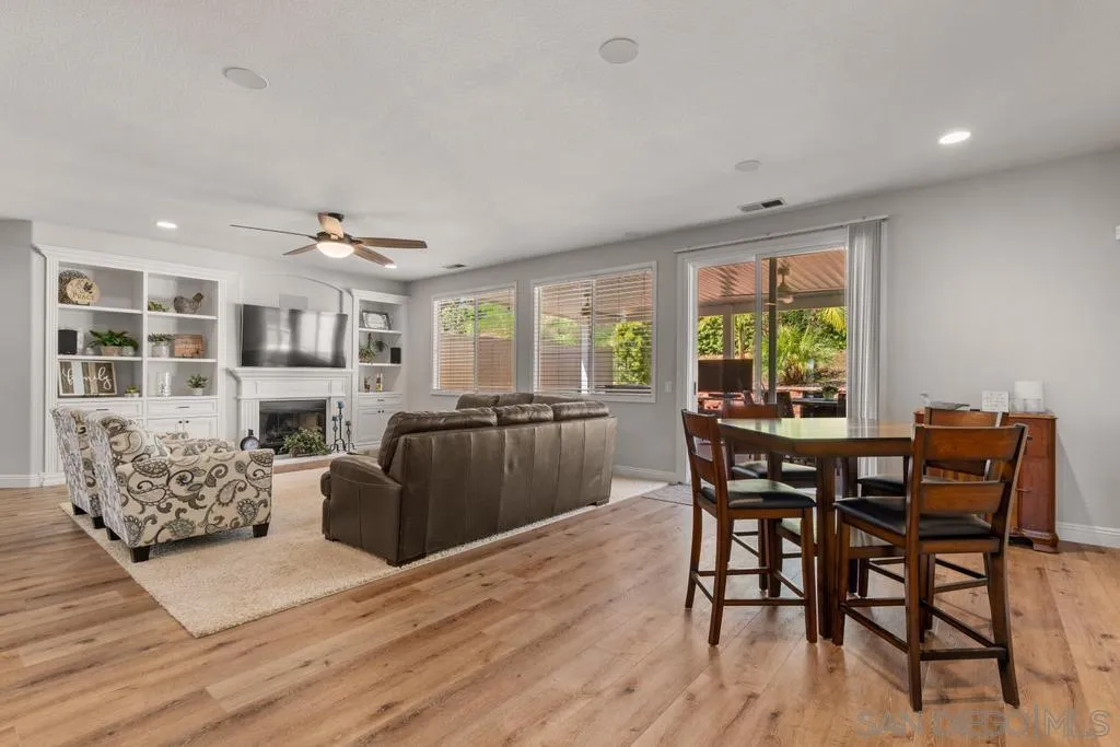 1253 Sunset Heights Road Escondido, CA 92026 - Photo 11 of 30 a view of a dining room with furniture and wooden floor