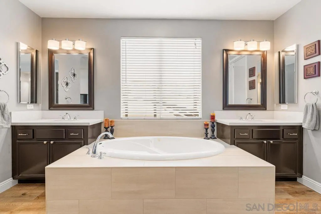 1253 Sunset Heights Road Escondido, CA 92026 - Photo 14 of 30 a bathroom with a bathtub sink vanity and mirror