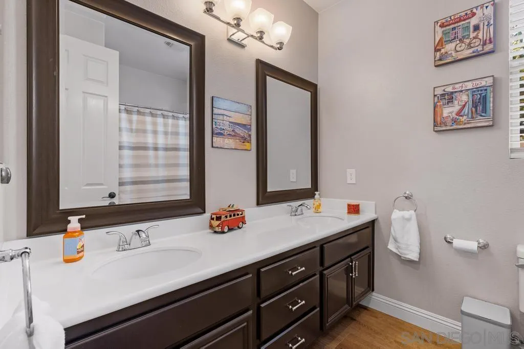 1253 Sunset Heights Road Escondido, CA 92026 - Photo 19 of 30 a bathroom with a sink and a mirror