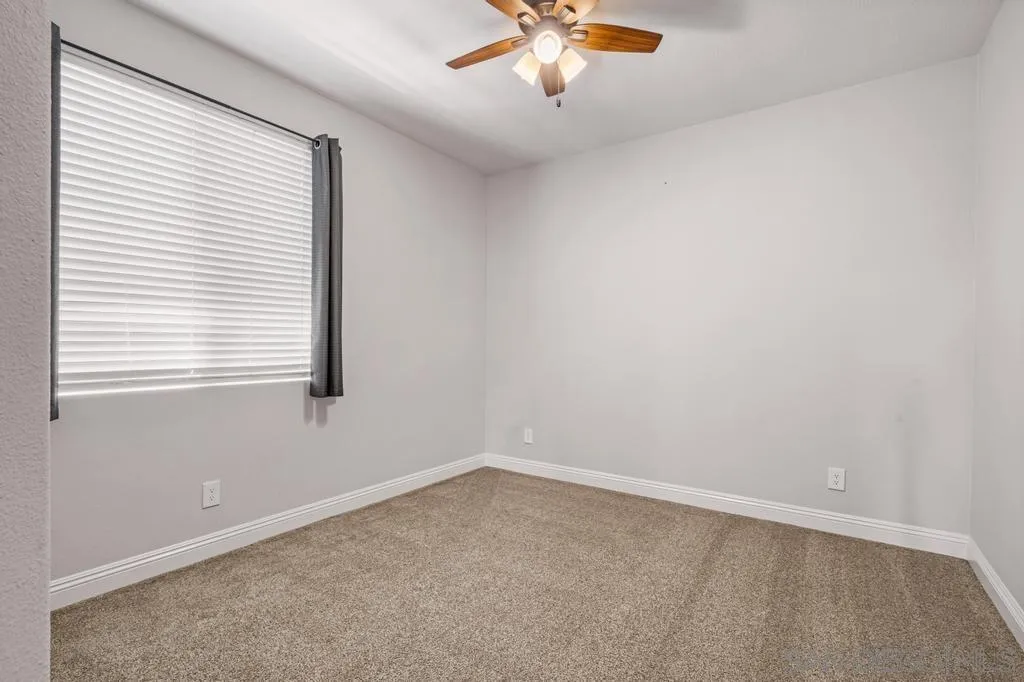 1253 Sunset Heights Road Escondido, CA 92026 - Photo 20 of 30 an empty room with a window