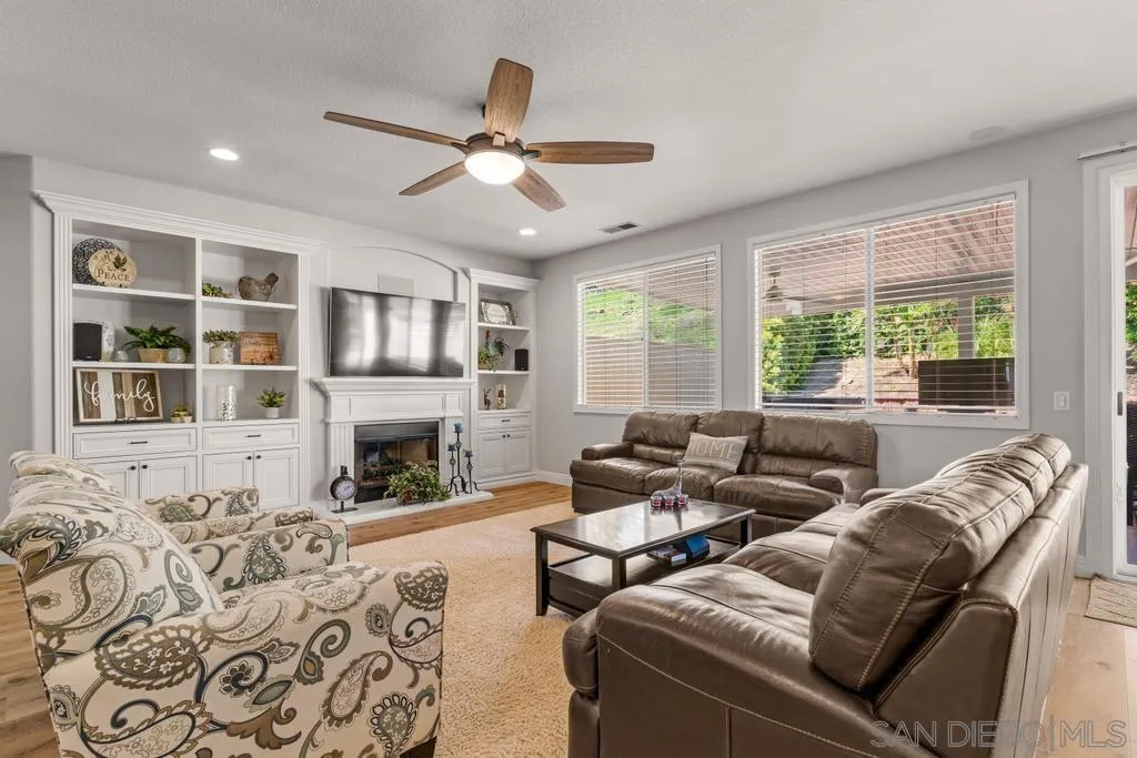 1253 Sunset Heights Road Escondido, CA 92026 - Photo 10 of 30 a living room with furniture fireplace and a large window