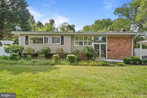 a view of a house with a yard and plants