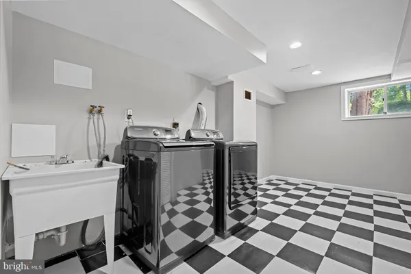 a kitchen with a stove a sink and a refrigerator