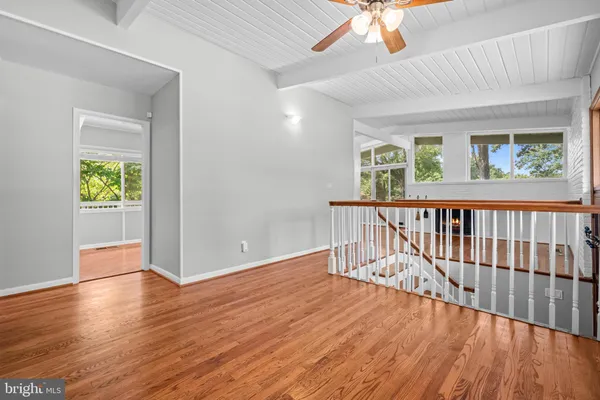 a view of livingroom with hardwood floor and a ceiling fan