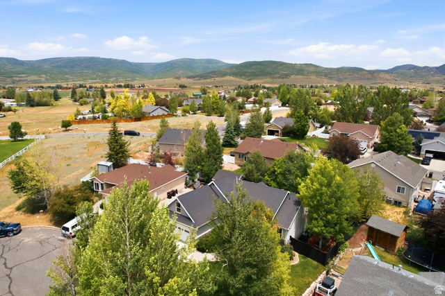5196 Rodeo Circle Oakley, UT 84055 - Photo 55 of 57 Suburban neighborhood featuring residences with varied architectural styles and mature landscaping, framed by distant mountains and open fields