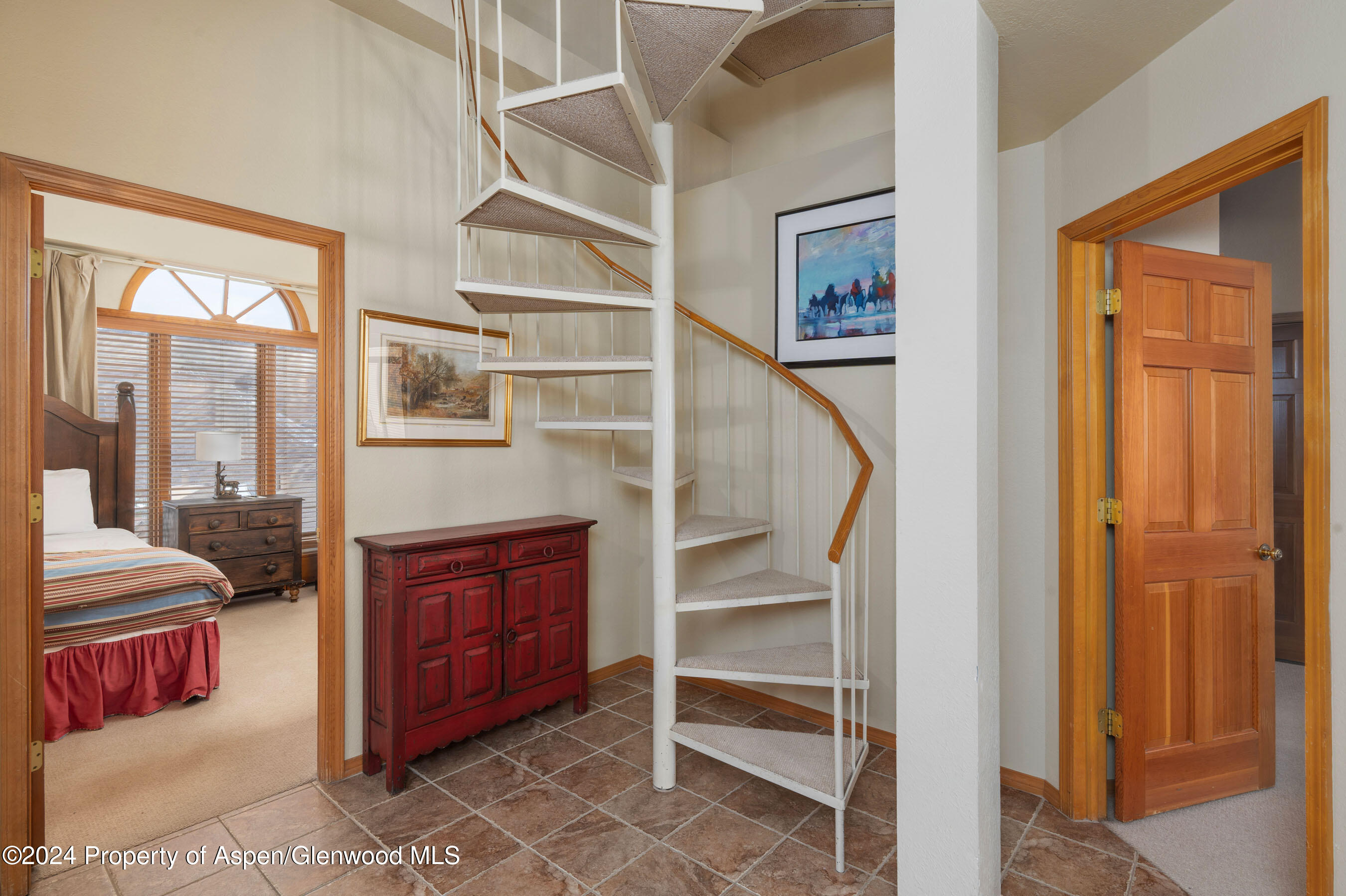 476 Wood Road, Unit 41 Snowmass Village, CO 81615 - Photo 14 of 29 Spiral Stairs to Second Level Suite