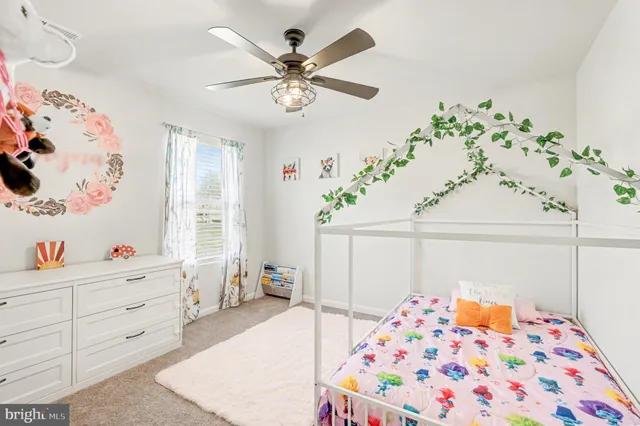 a bedroom with furniture and window