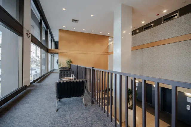 a hallway with stairs and furniture
