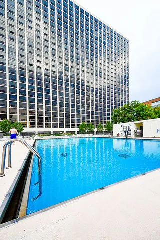 a view of swimming pool with seating area