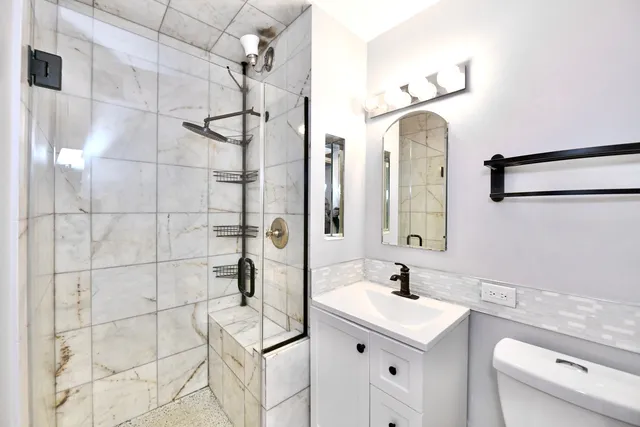 a bathroom with a sink and mirror