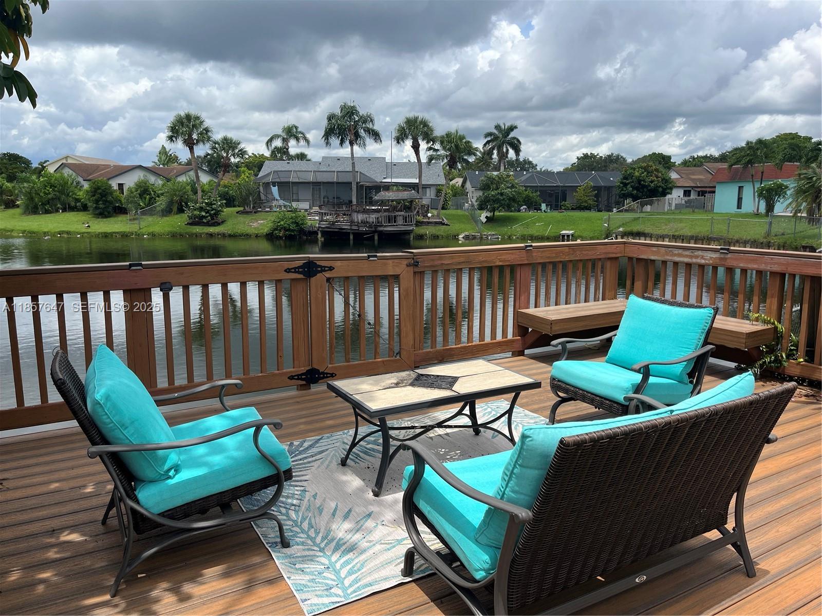 5217 Southwest 87th Avenue Cooper City, FL 33328 - Photo 6 of 8 a view of a chairs and table in the roof deck