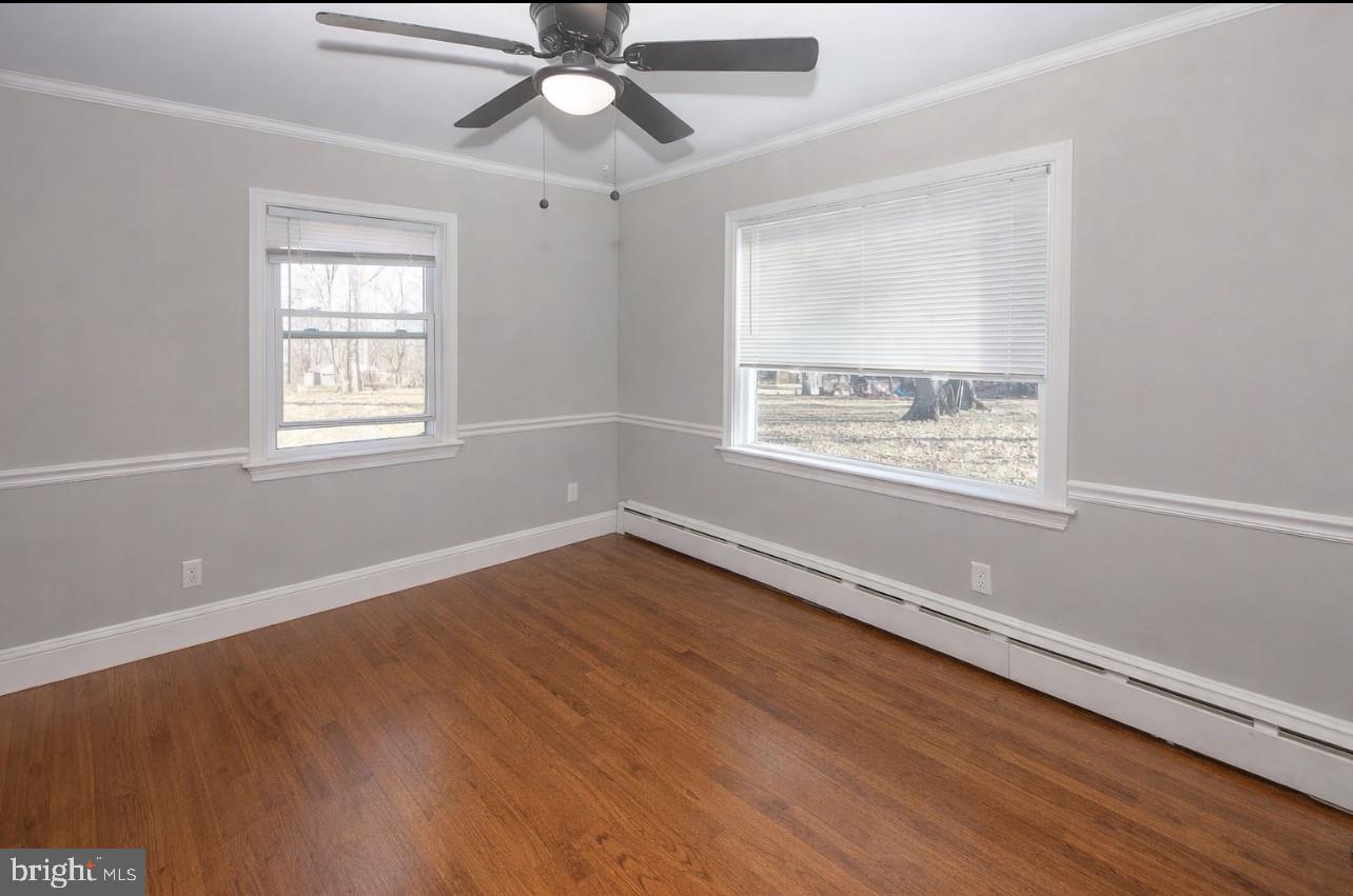 2947 Potshop Road Norristown, PA 19403 - Photo 11 of 41 a view of an empty room with wooden floor and a window