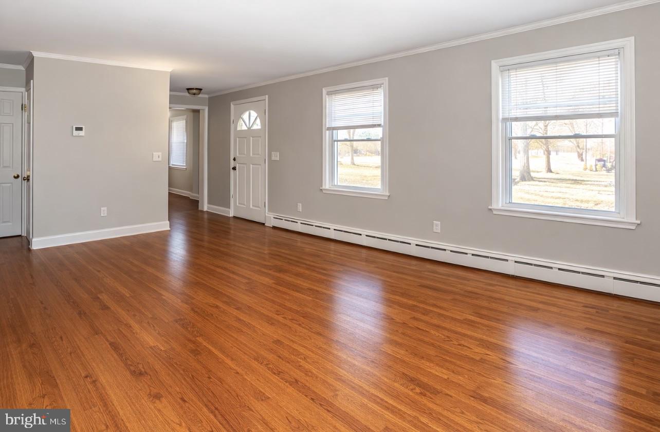 2947 Potshop Road Norristown, PA 19403 - Photo 13 of 41 an empty room with wooden floor and windows