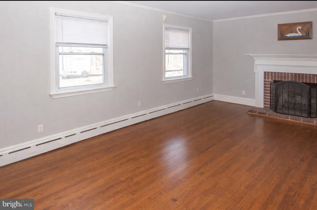 2947 Potshop Road Norristown, PA 19403 - Photo 14 of 41 an empty room with wooden floor and windows