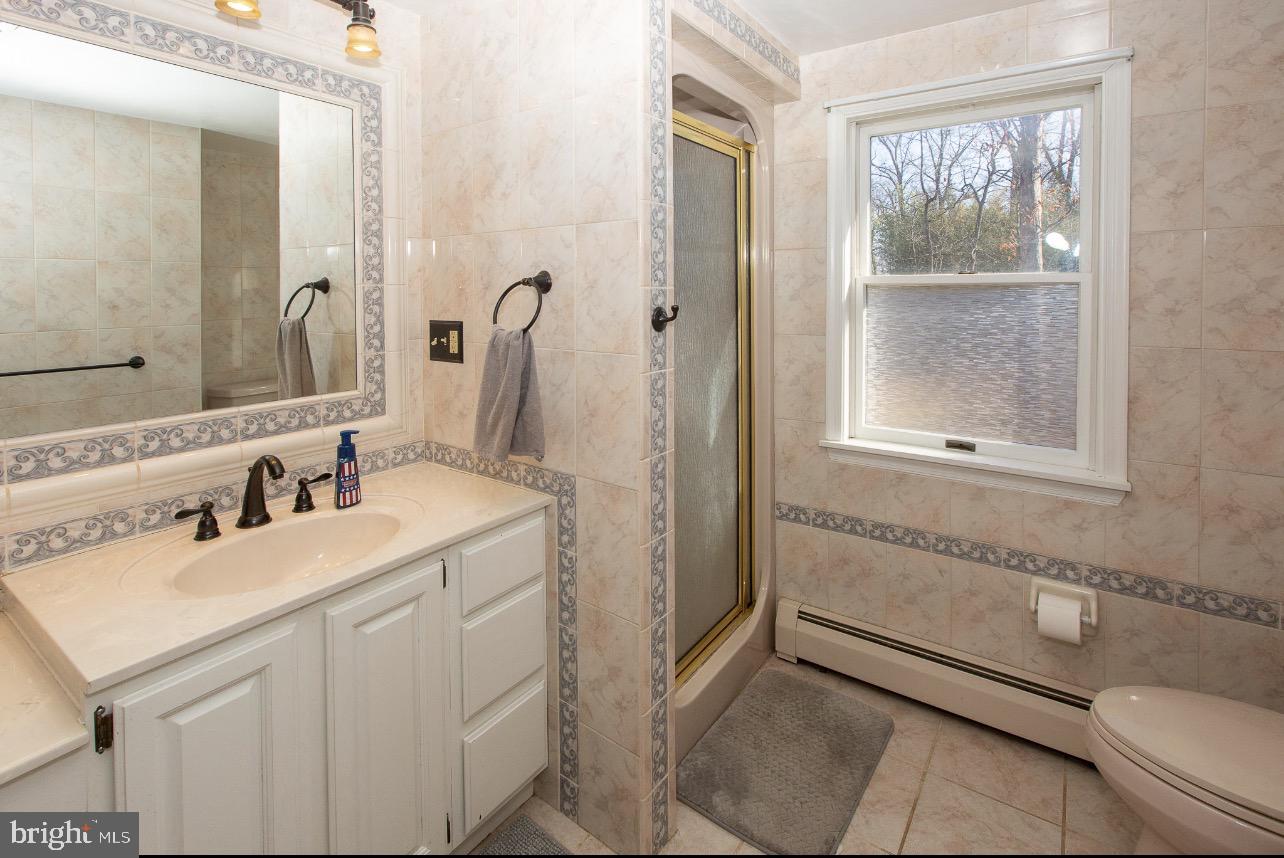 2947 Potshop Road Norristown, PA 19403 - Photo 22 of 41 a bathroom with a sink and a mirror