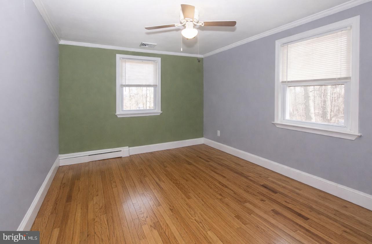 2947 Potshop Road Norristown, PA 19403 - Photo 25 of 41 a view of an empty room with wooden floor and a window