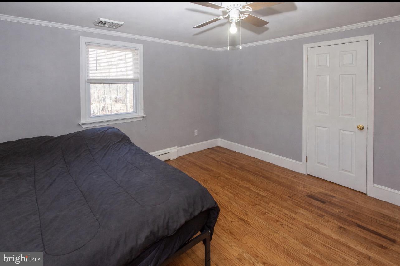 2947 Potshop Road Norristown, PA 19403 - Photo 28 of 41 wooden floor in an empty room with a window