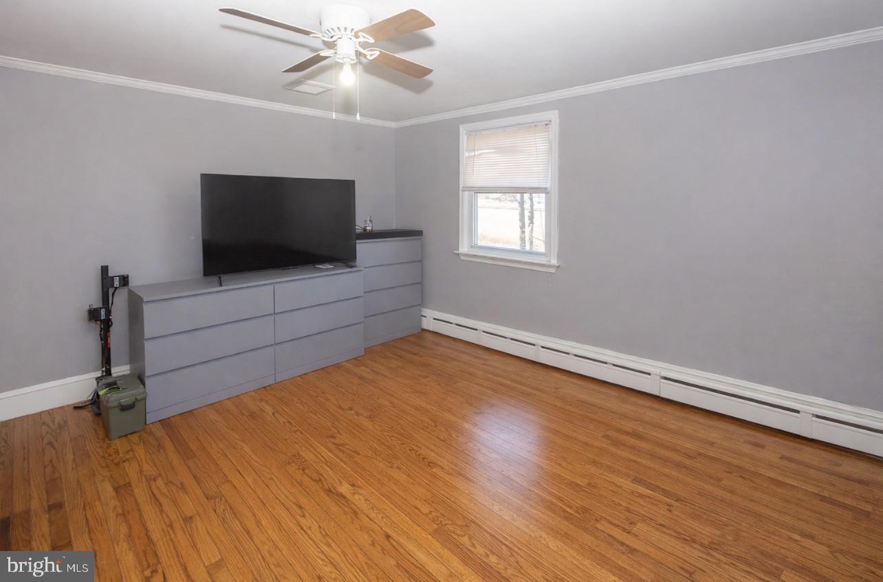 2947 Potshop Road Norristown, PA 19403 - Photo 29 of 41 wooden floor in an empty room with a window