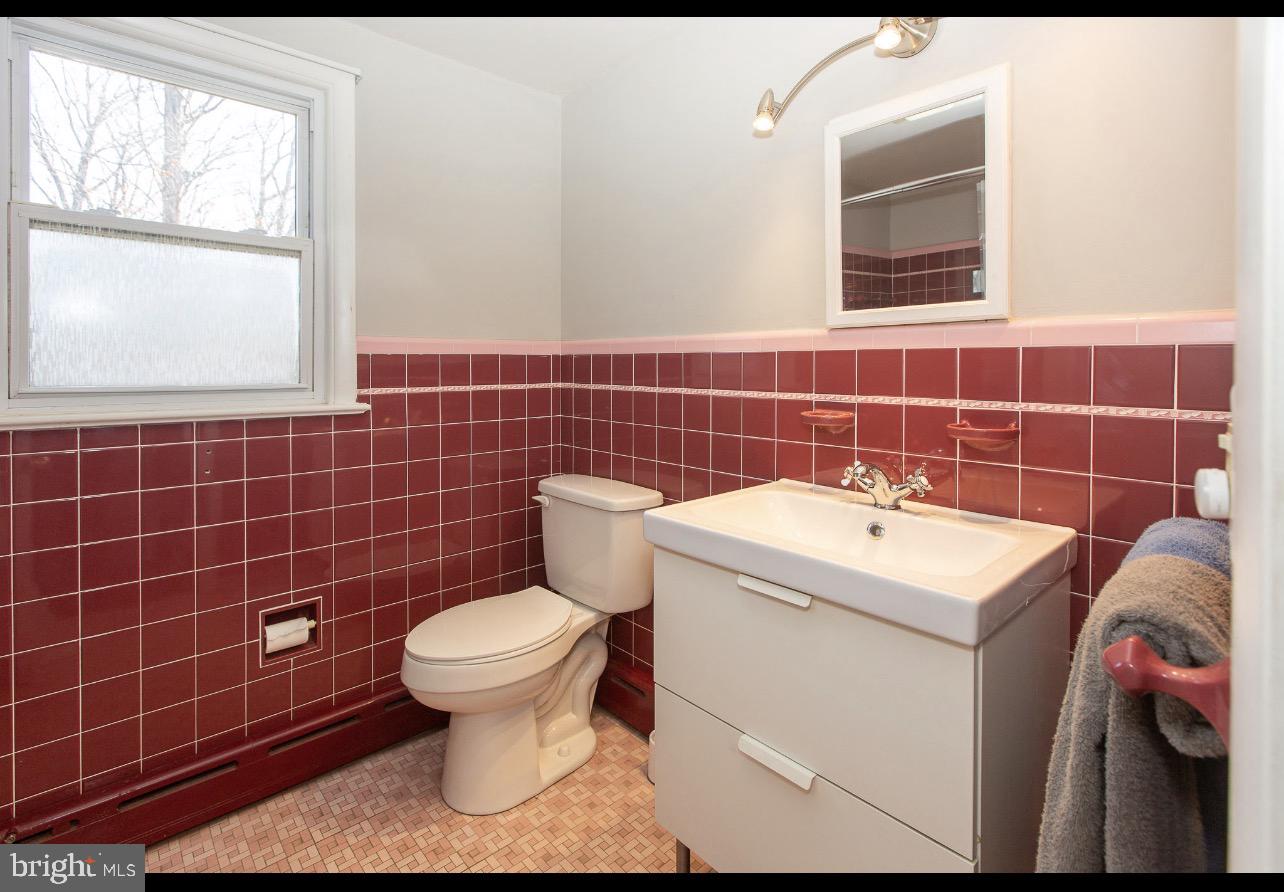 2947 Potshop Road Norristown, PA 19403 - Photo 30 of 41 a bathroom with a sink a toilet and a mirror