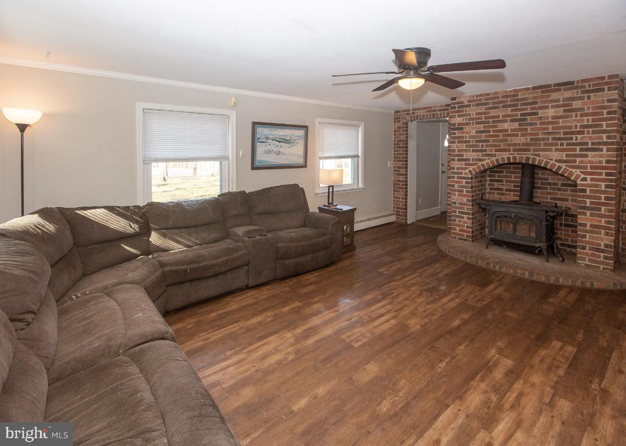 2947 Potshop Road Norristown, PA 19403 - Photo 3 of 41 a living room with furniture a fireplace and a window