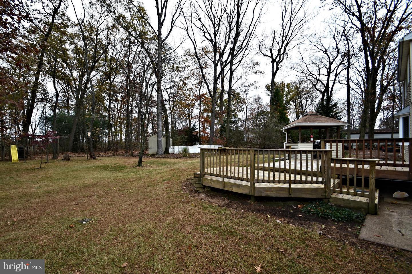 2947 Potshop Road Norristown, PA 19403 - Photo 37 of 41 a view of street with wooden fence and trees