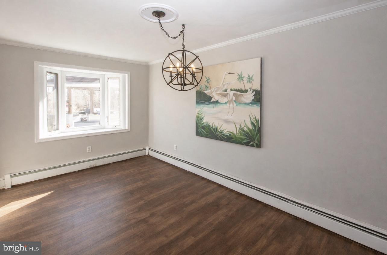 2947 Potshop Road Norristown, PA 19403 - Photo 7 of 41 an empty room with wooden floor and windows