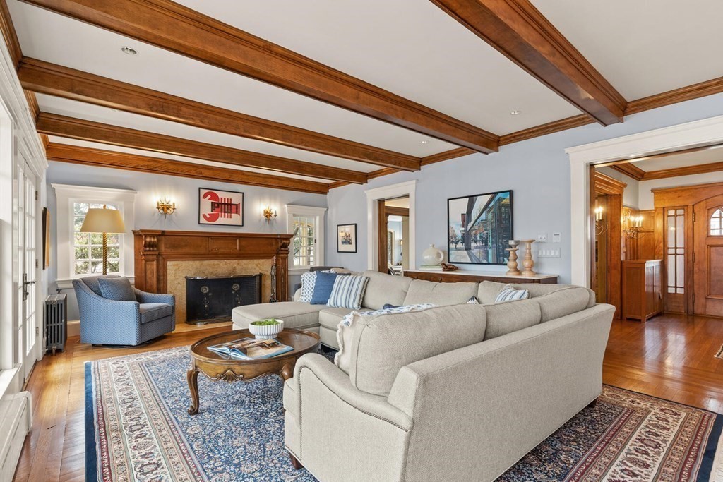 32 Everett Avenue Winchester, MA 01890 - Photo 11 of 42 a living room with furniture and a fireplace