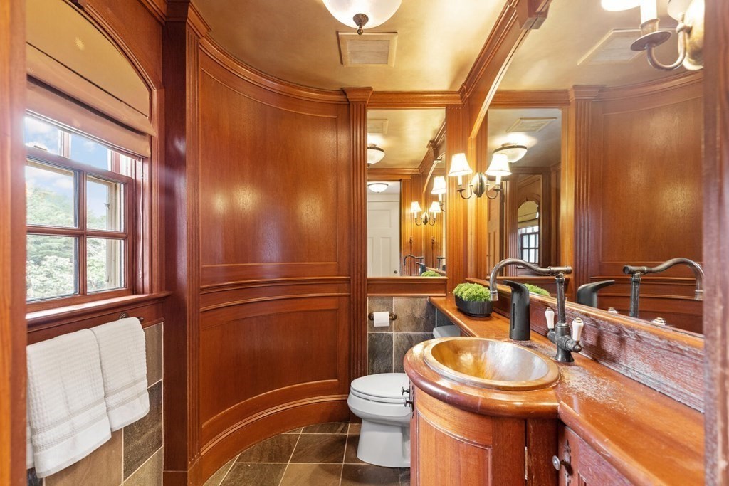 32 Everett Avenue Winchester, MA 01890 - Photo 14 of 42 a bathroom with a toilet a sink and a mirror