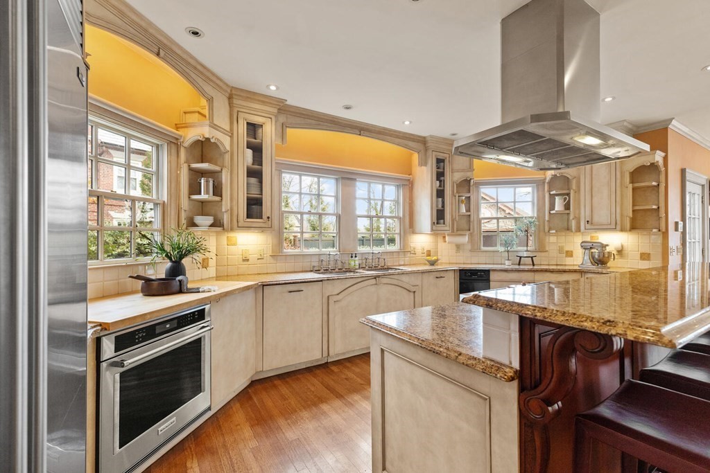 32 Everett Avenue Winchester, MA 01890 - Photo 17 of 42 a kitchen with a sink stove and cabinets