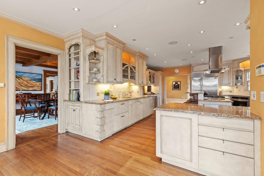 32 Everett Avenue Winchester, MA 01890 - Photo 20 of 42 a kitchen with stainless steel appliances granite countertop a stove and a sink