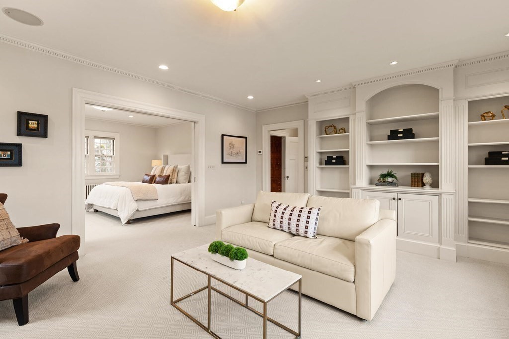 32 Everett Avenue Winchester, MA 01890 - Photo 24 of 42 a living room with furniture and a book shelf
