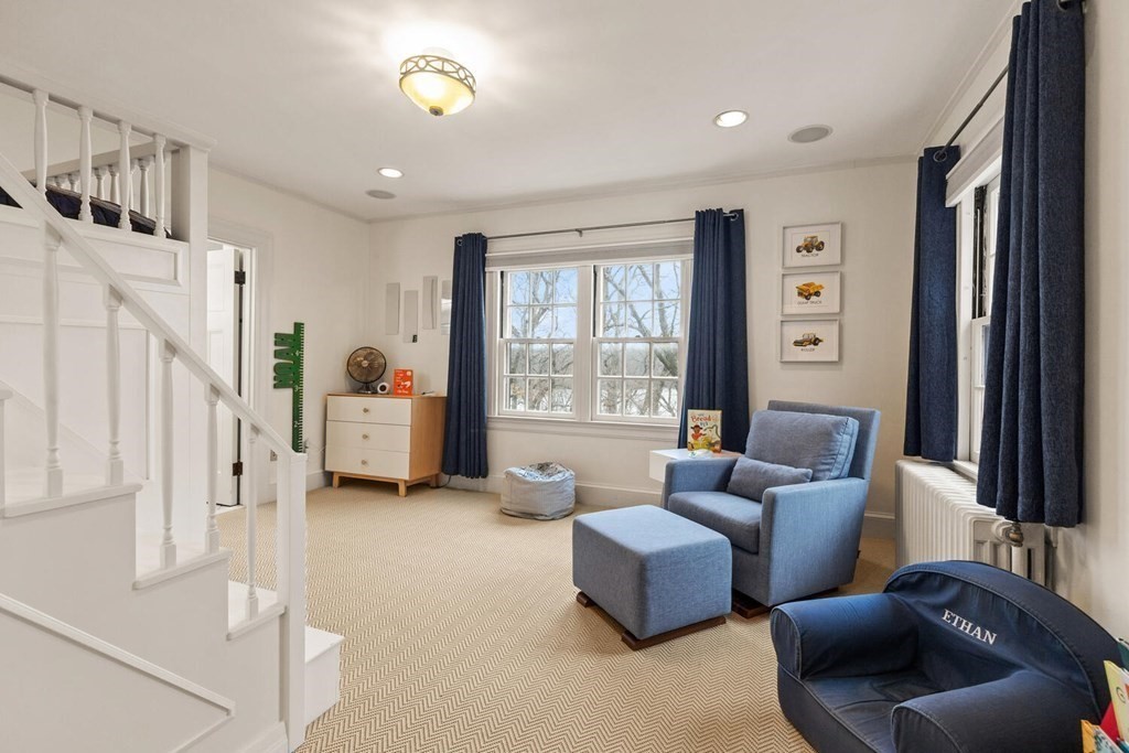 32 Everett Avenue Winchester, MA 01890 - Photo 27 of 42 a living room with furniture and a large window
