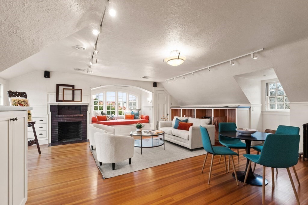 32 Everett Avenue Winchester, MA 01890 - Photo 30 of 42 a living room with furniture fireplace and wooden floor