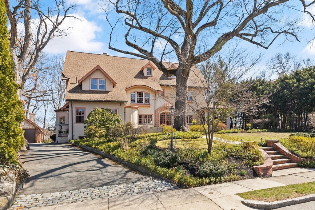 32 Everett Avenue Winchester, MA 01890 - Photo 3 of 42 a front view of a house with a yard