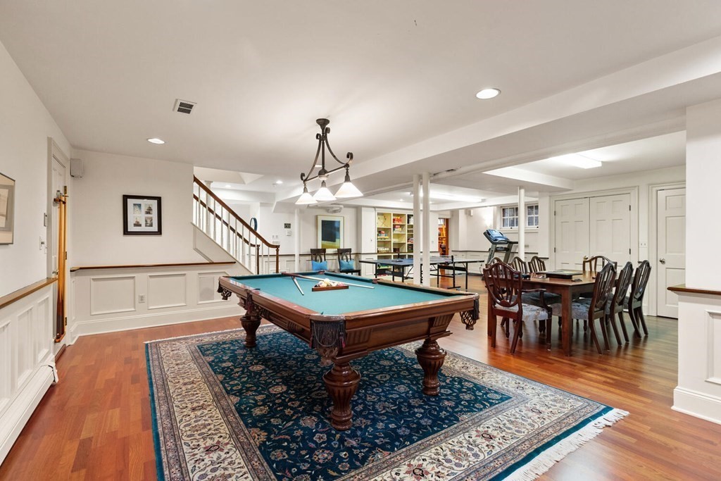 32 Everett Avenue Winchester, MA 01890 - Photo 31 of 42 a room with lots of tables a chandelier and pool table