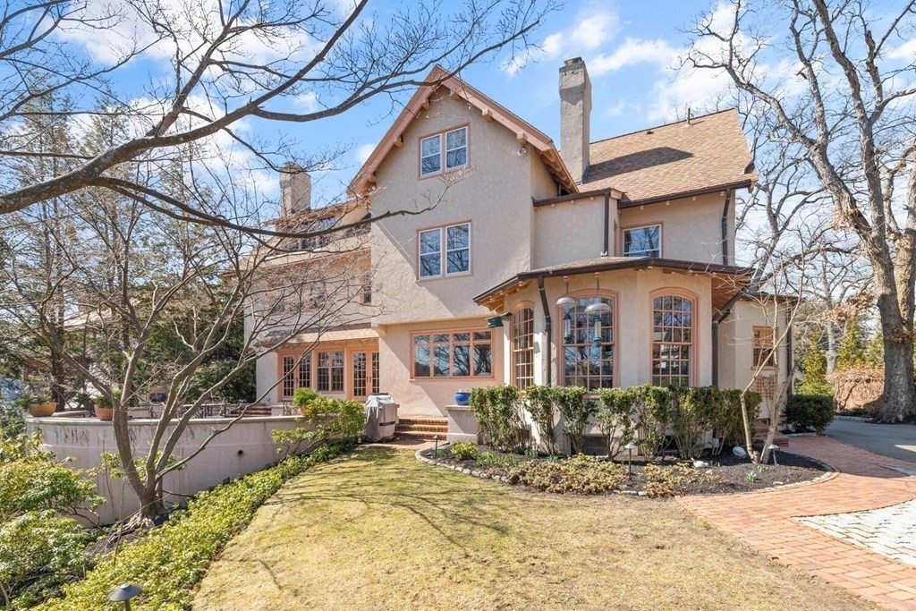 32 Everett Avenue Winchester, MA 01890 - Photo 34 of 42 a front view of a house with a yard