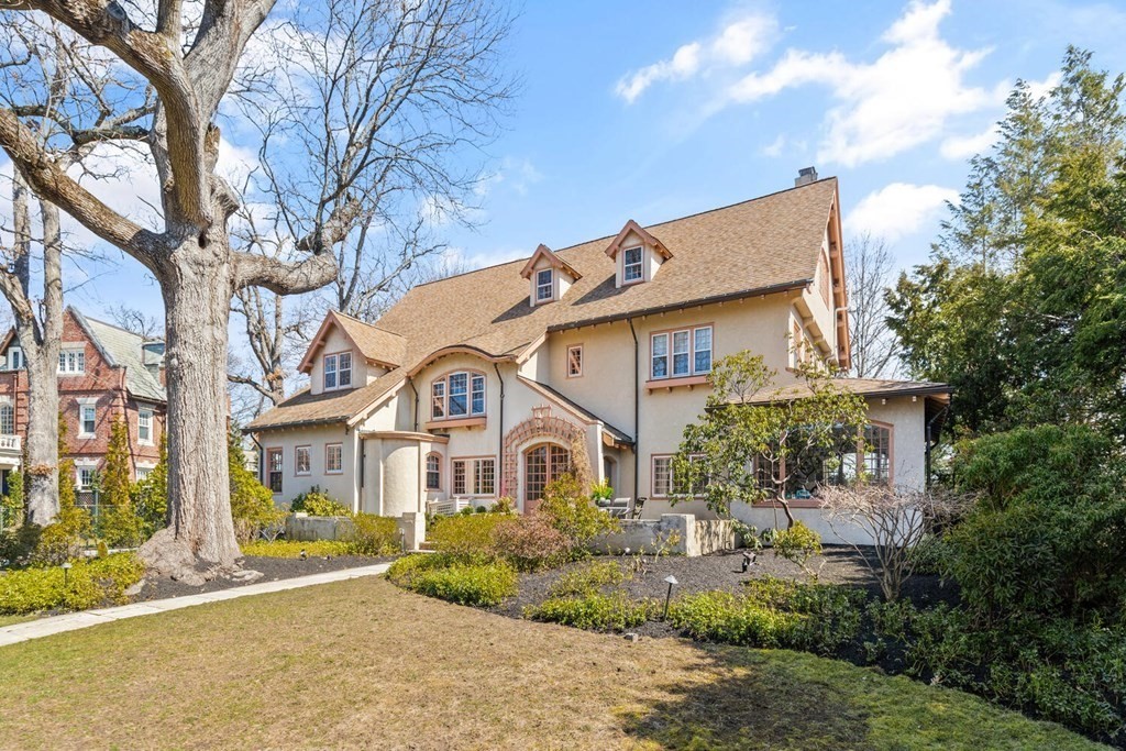 32 Everett Avenue Winchester, MA 01890 - Photo 5 of 42 a front view of a house with a garden