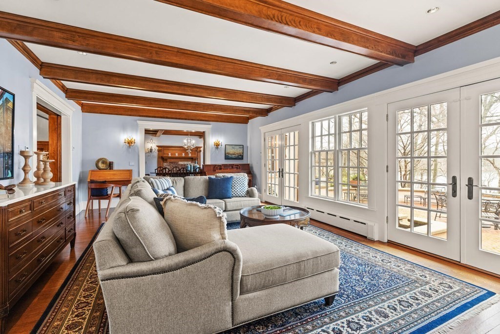32 Everett Avenue Winchester, MA 01890 - Photo 10 of 42 a living room with furniture and a floor to ceiling window