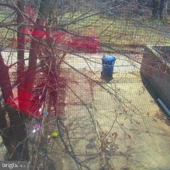 a white toilet sitting next to a bath tub and a shower