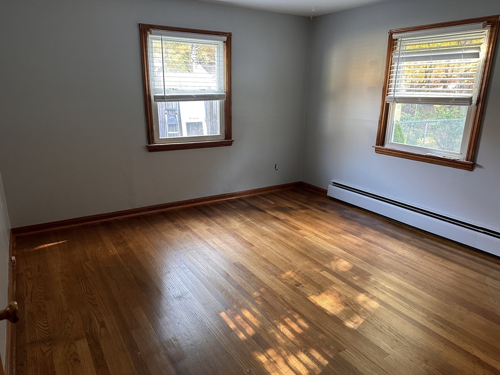 37 Bretton Road Springfield, MA 01119 - Photo 13 of 36 a view of an empty room with wooden floor and a window